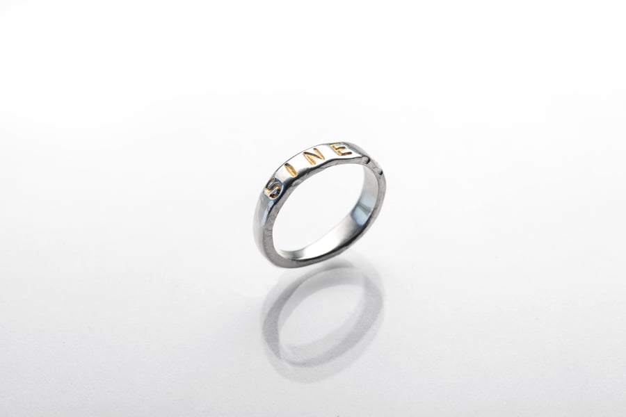 Image of silver classical ring with gold plated letters and inscription in Latin