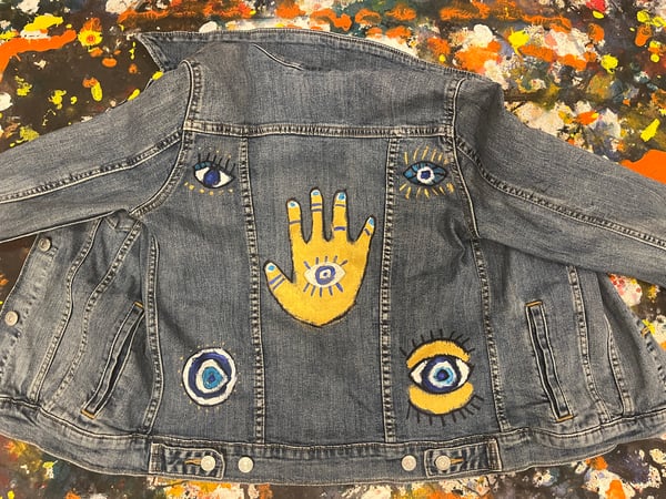 Image of Evil Eye Protection  painted on Levi’s Denim Jacket - acrylic paint/markers 