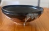 Shallow bowl with black and white glazes