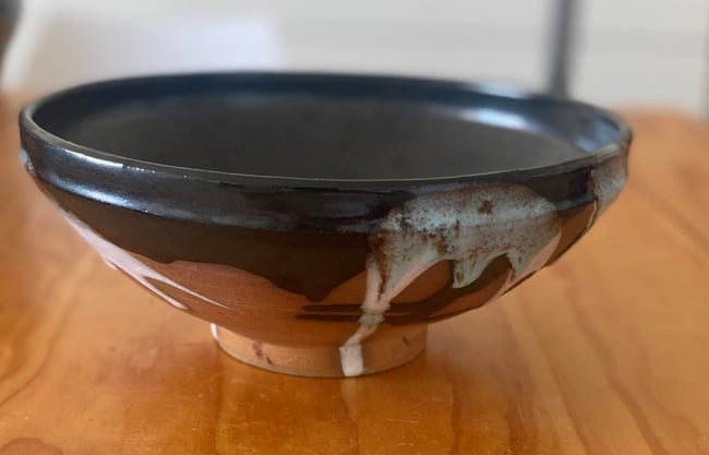 Shallow bowl with black and white glazes