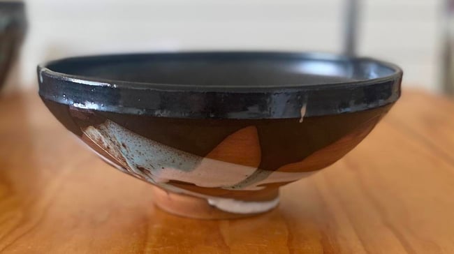 Shallow bowl with black and white glazes