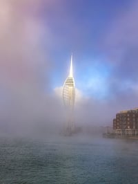 Spinnaker Tower between the clouds