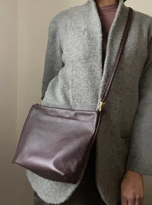 Image of frame clutch with removable strap 
