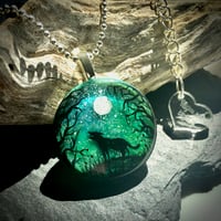 Image 1 of Wolf and Moon Northern Lights Round Resin Pendant