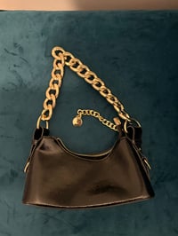Image 1 of Black and gold bag