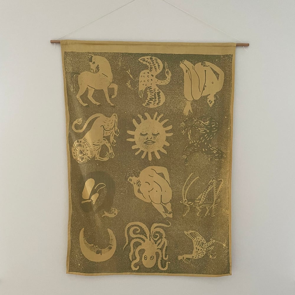 Lithographed beasts silk wall hanging - grey on gold