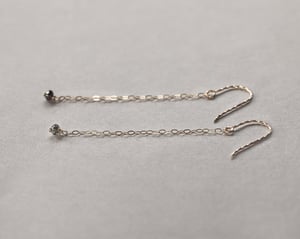 Image of 9ct yellow gold long chain grey diamond bead earrings