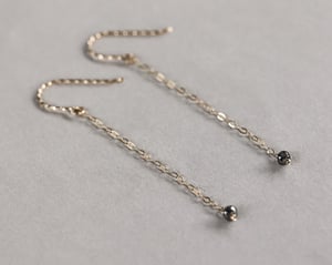 Image of 9ct yellow gold long chain grey diamond bead earrings