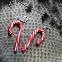 Image 4 of red arched studs