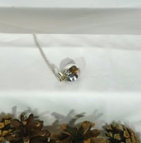 Image of Sterling silver nested bowl pendant with garnet