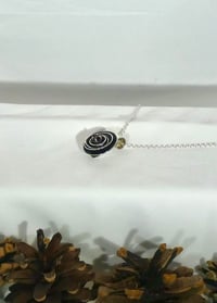 Image of Sterling silver nested bowl pendant with garnet