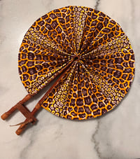 Image 1 of Brown and Yellow Fan