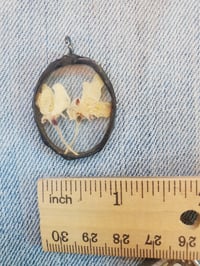 Image 3 of Apple blossoms encased in glass