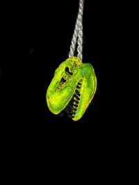 Image 1 of Mini yellow opal T-rex skull pendant. 