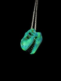 Image 1 of Sea slyme T-rex skull pendant. 