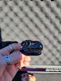 Image 1 of Blacked out galaxy T-rex skull pendant. 