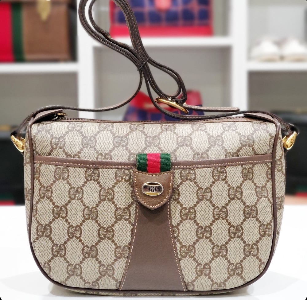 Image of Vtg Gucci Brown Monogram crossbody bag.