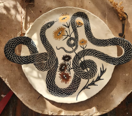 Image of Serpent handled platter with eye flowers