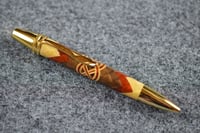 Image 2 of Segmented Wood Pen with Herringbone 360 Design that Features a Redheart and Maple Celtic Knot  #0600