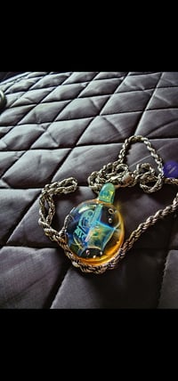 Image 1 of Lab group pendant with silver and gold fumed implosion.