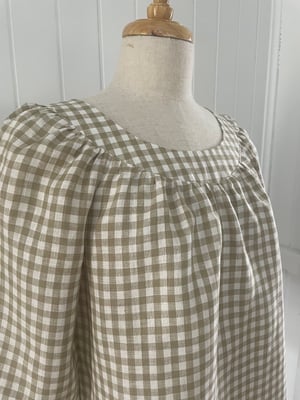 Image of The Natural Check Smock Top.