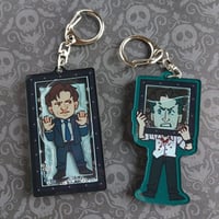 Image 1 of Saw V shaker charms