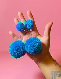 Image 1 of single color double pom pom earrings