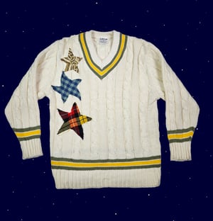 Upcycled star patch varsity sweater