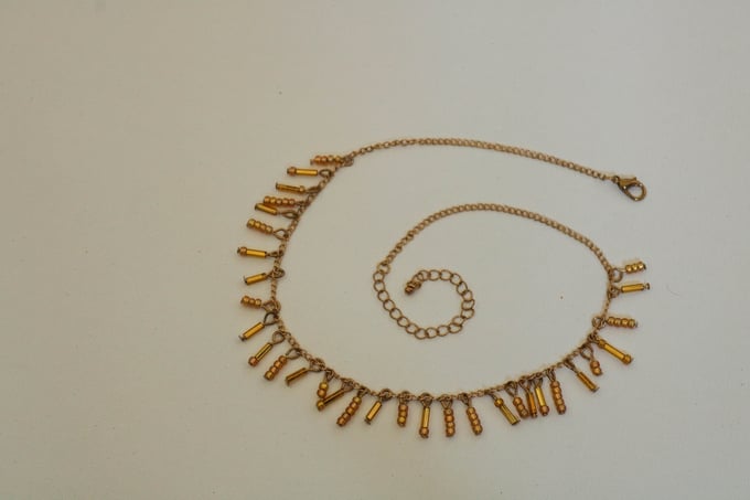 Image of gold dangly drop chain