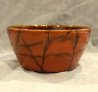 Image 1 of Small bowl - orange with brown lines