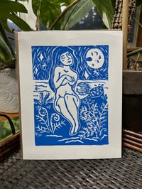Blue lady by the water