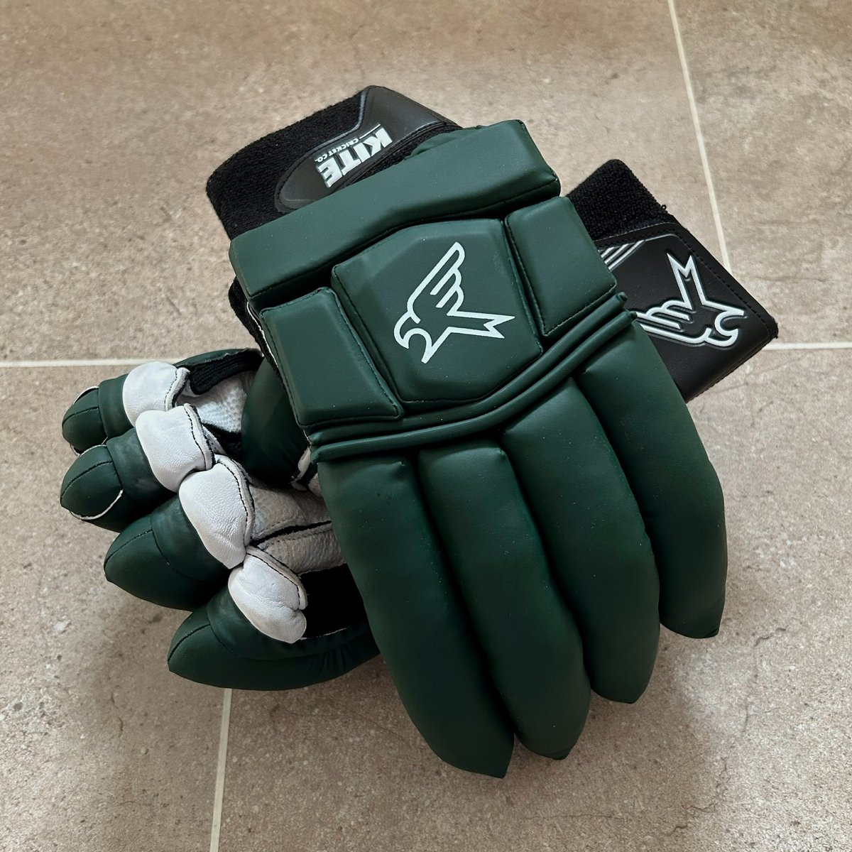 Green and black batting top gloves