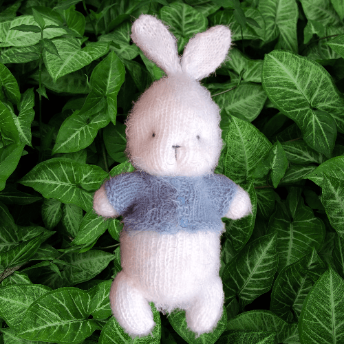 Image of Fluffy knitted teddy bear or bunny. Newborn