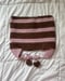 Image of striped brown & mauve bow earflap cat hat