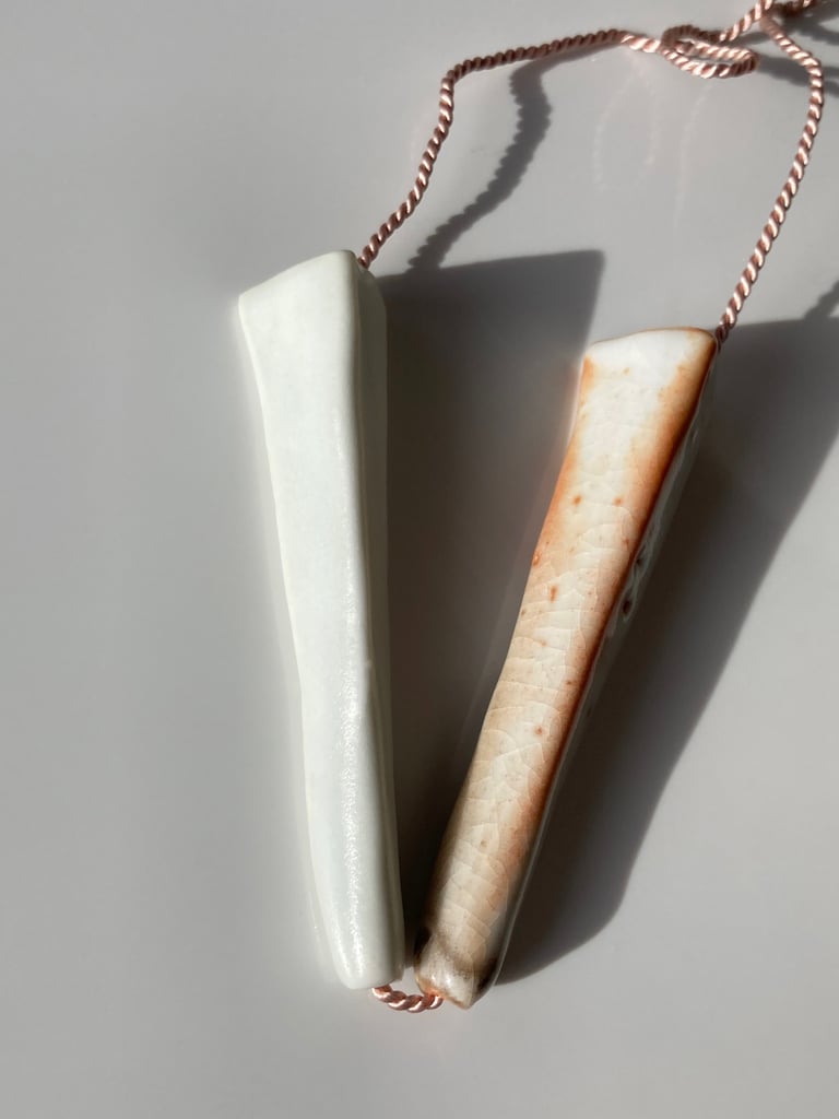 Porcelain necklace, silk chord in petal, white and white shino glazes