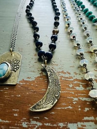 Image 17 of faceted lapis and brown garnet necklace with moon quote pendant