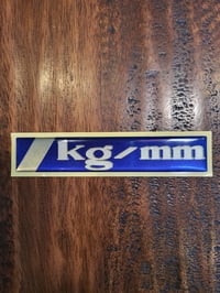 Image 1 of Metric kg / mm Gel Badge