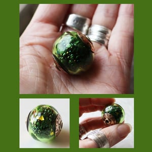 Irridescent Iguana Party Ball - a glass and red brass bead stuffed with stuff