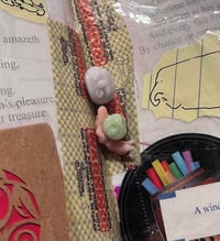 snail and face bead