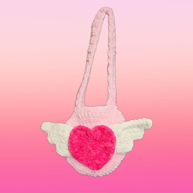 Image of pink fuzzy angel heart bag