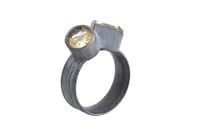 Image 2 of Silver Strata ring with a round and square rutile quartz, set in oxidized silver. 