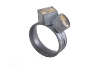 Image 3 of Silver Strata ring with a round and square rutile quartz, set in oxidized silver. 