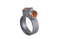 Image 2 of Silver Strata ring with a round and square orange citrine, set in oxidized silver.