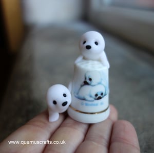 Two Wee Baby Seals on Thimble