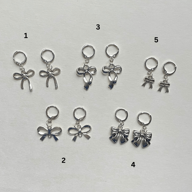 silver bow silver huggie earrings