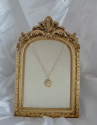 Image 1 of Gold oval shell charm with pearl