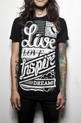 Image of "Live Love Inspire Dream" on black shirt