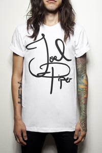 Image of "Signature Tee" on white shirt