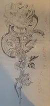 SNAKE IN A ROSE OF A GARDEN