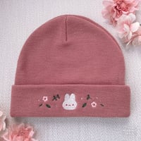 Image 2 of flower bun beanie